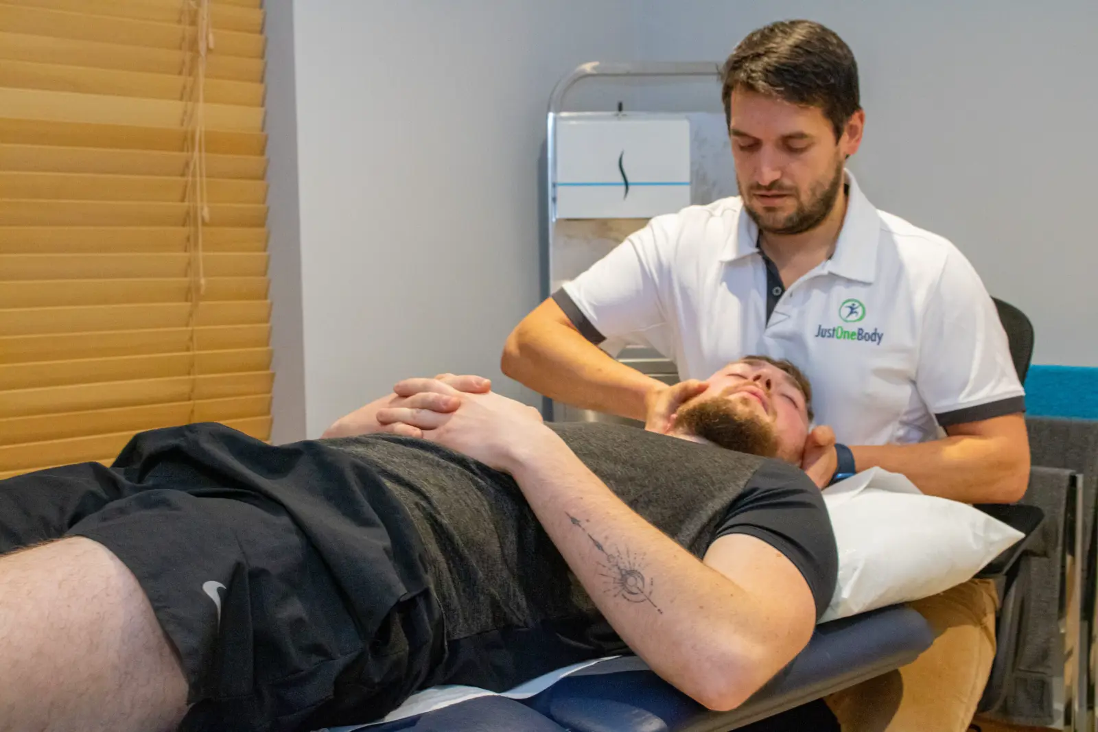 Osteopath treating a patient's neck at Just One Body, New Ross