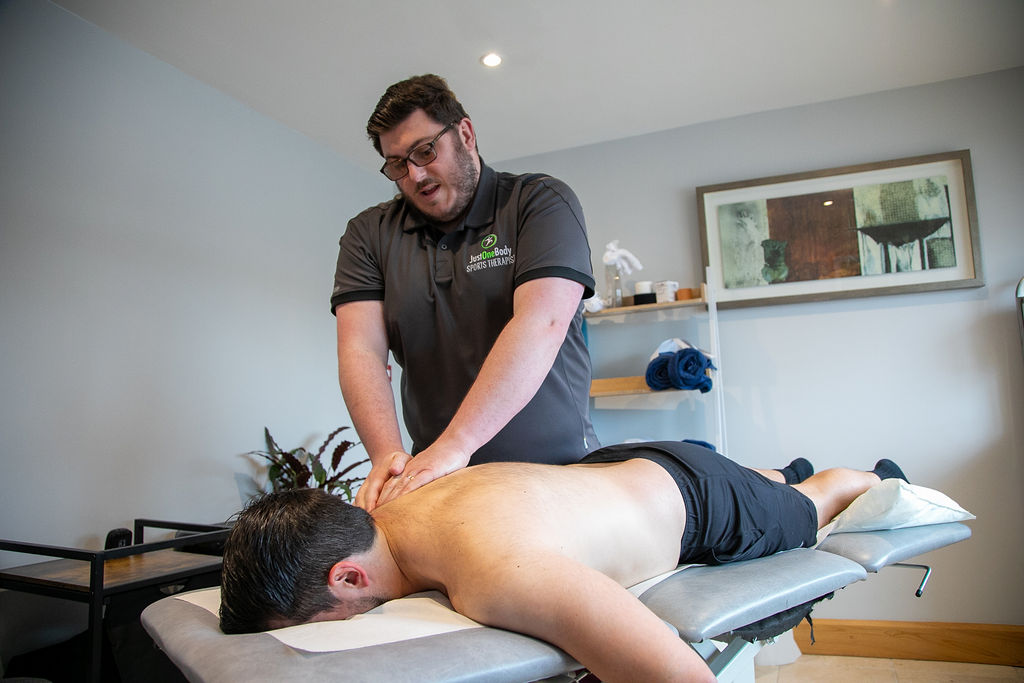 Therapist providing a sports massage
